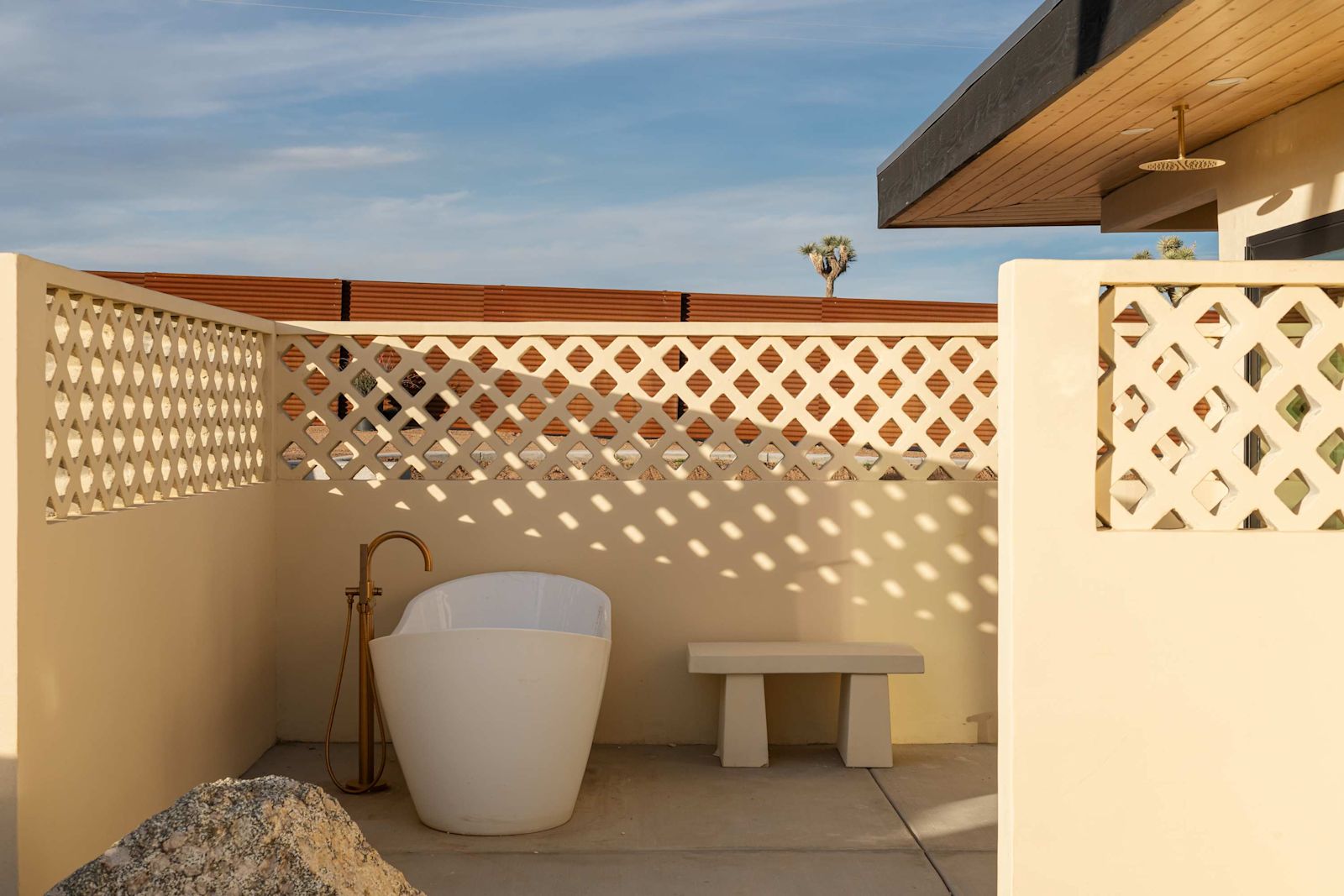 Private outdoor soaking tub courtyard in the sun