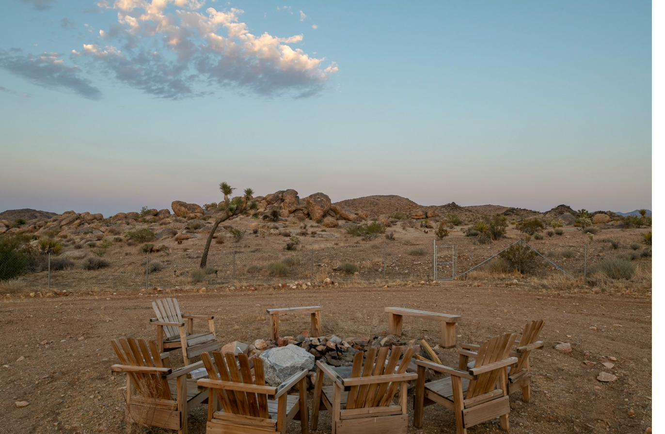Stone firepit circle with canyon boulders at dusk