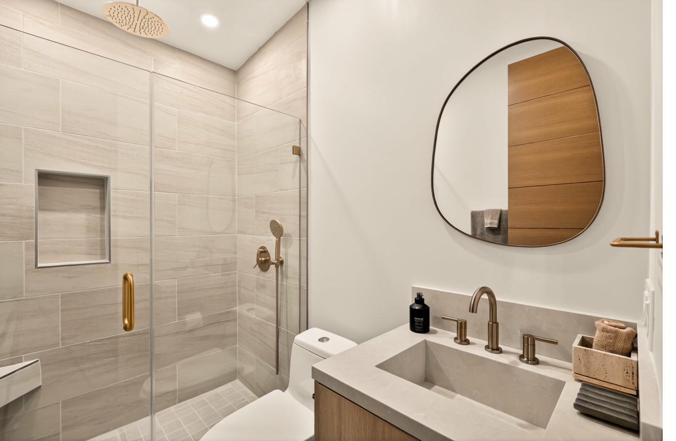 Spa bathroom with rain shower and organic mirror