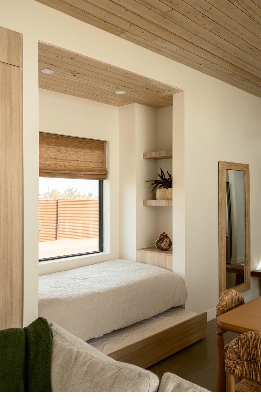 Bedroom alcove with wood shelving