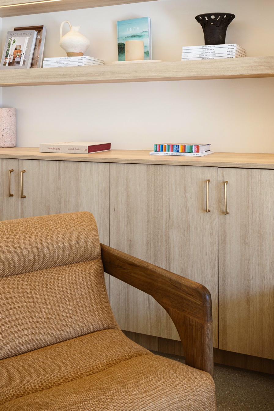 Curated lounge chair and built-in library shelves