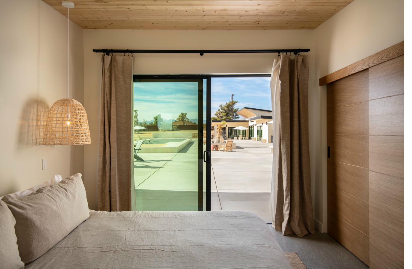 King bedroom with pool-view sliding doors