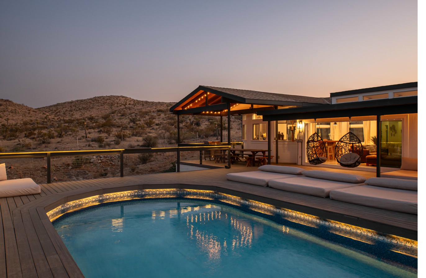 Cloud Canyon — pool lit at dusk with canyon and string lights