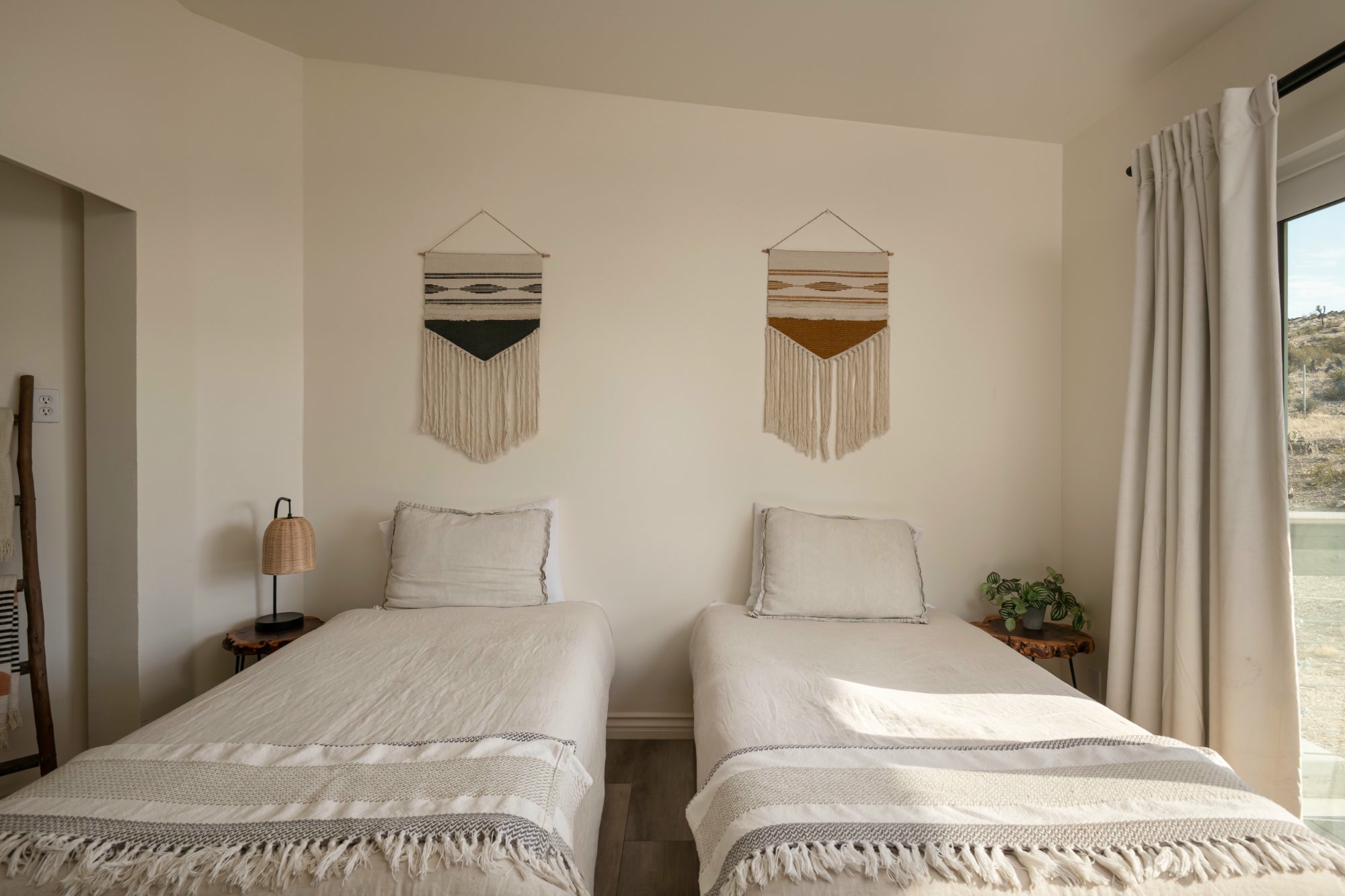 Desert-boho bedroom with woven wall hangings