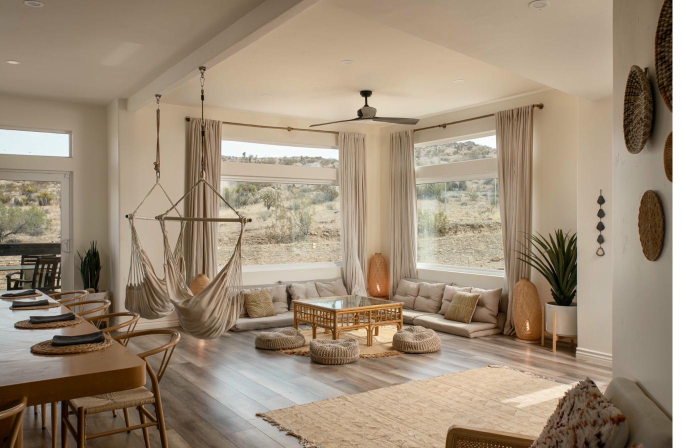 Boho living room with hammock chairs and desert views